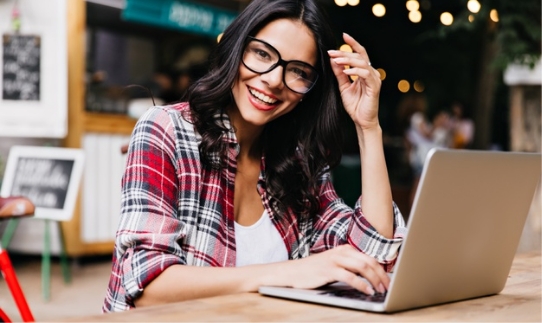 glamorous-female-freelancer-enjoying-morning-working-with-laptop-photo-cheerful-latin-lady-checkered-shirt-posing-glasses_197531-10658